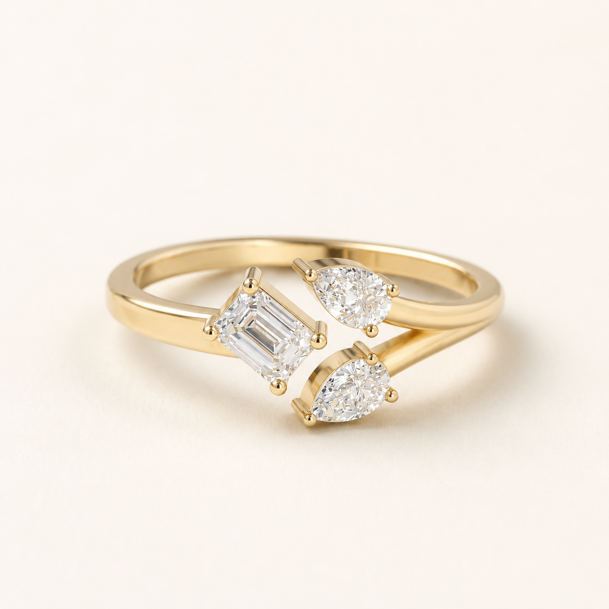 0.25 CT Emerald Cut Lab Grown Diamond Ring with Pear Accents in Yellow, White & Rose Gold