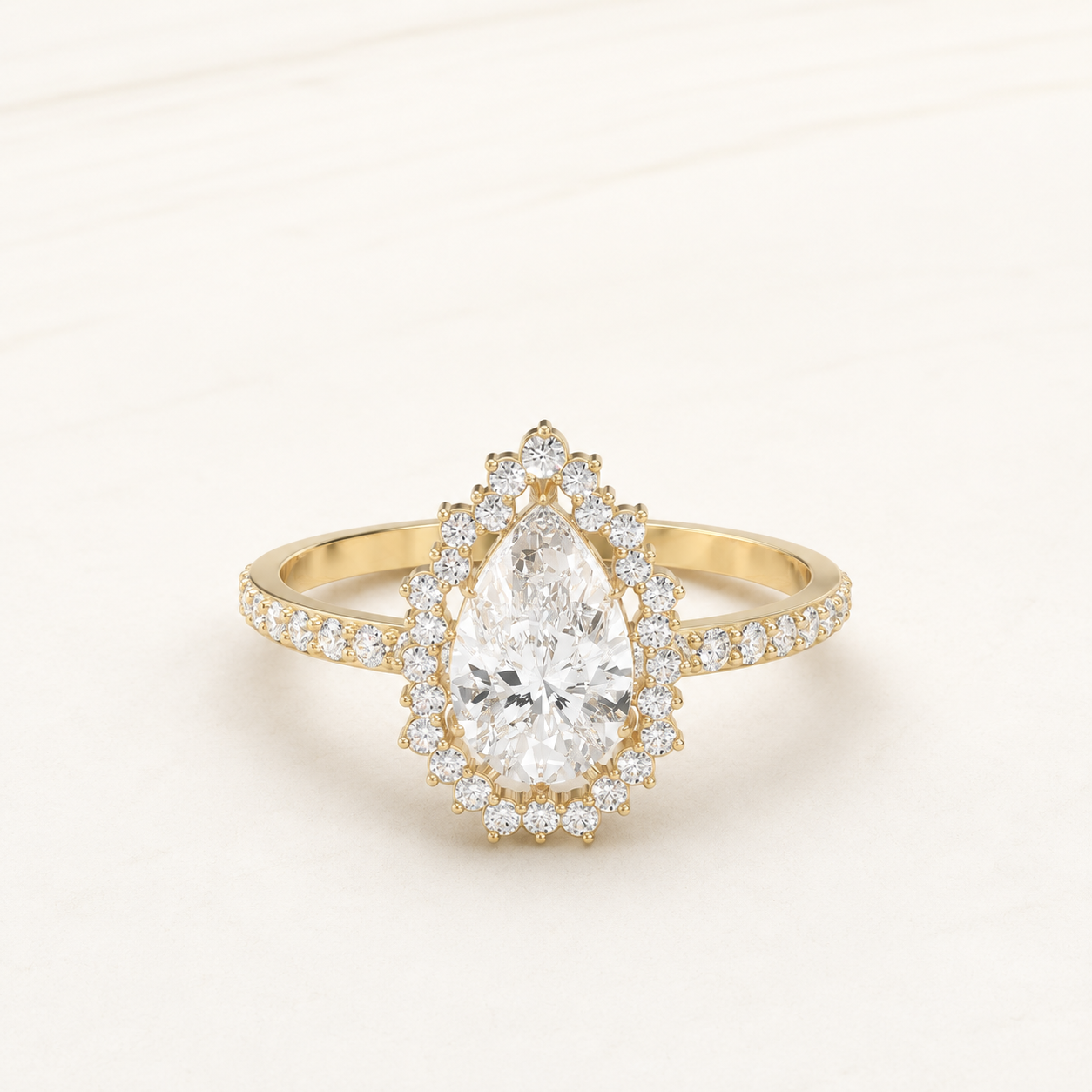 0.880 CT Pear Halo Diamond Ring in Yellow Gold, White Gold & Rose Gold