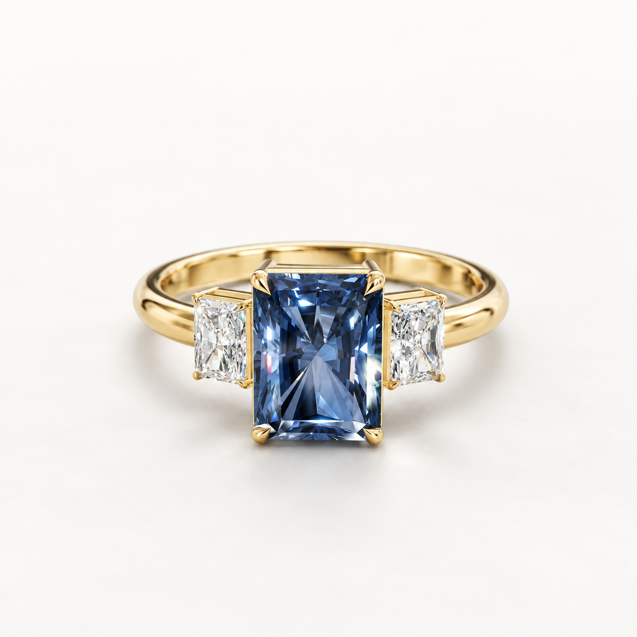 2.300 CT Blue Radiant Cut Lab Grown Diamond Three Stone Ring in White Gold, Yellow Gold & Rose Gold